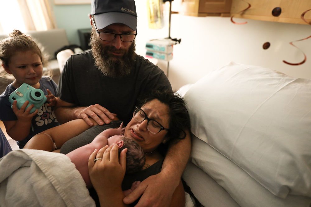 A family together in the hospital after their baby arrives