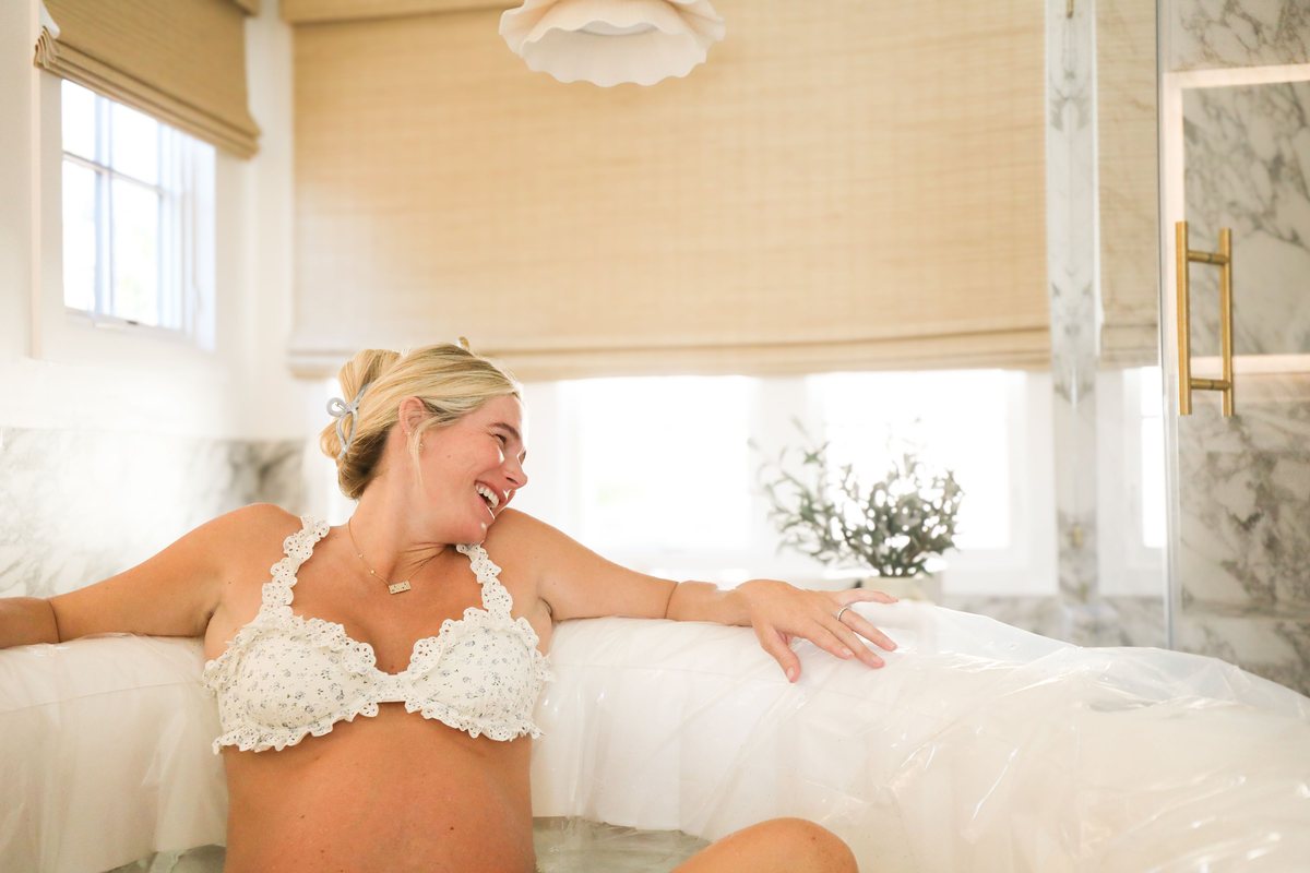 A mother during a calm water birth in Orange County